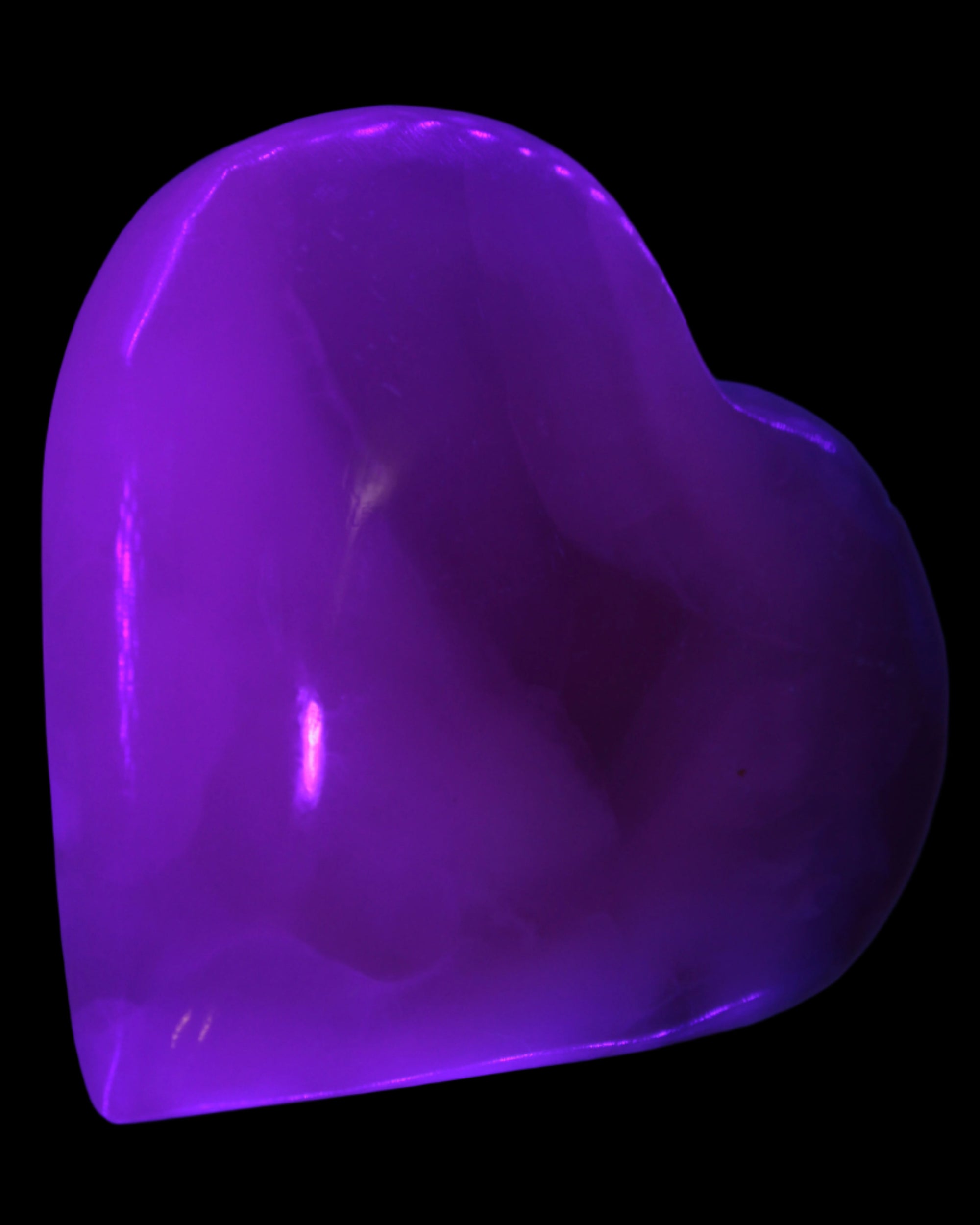 Mangano Calcite hand-carved heart 67-94mm  129-274g in UV light - Rocks and Things Store