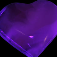 Mangano Calcite hand-carved heart 67-94mm  129-274g in UV light - Rocks and Things Store