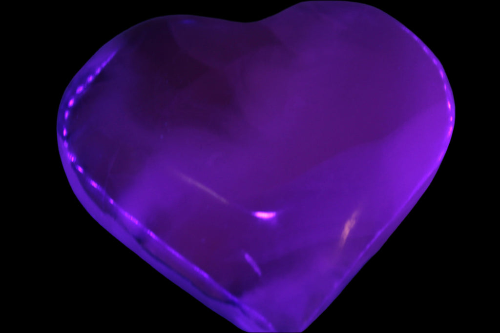Mangano Calcite hand-carved heart 67-94mm  129-274g in UV light - Rocks and Things Store