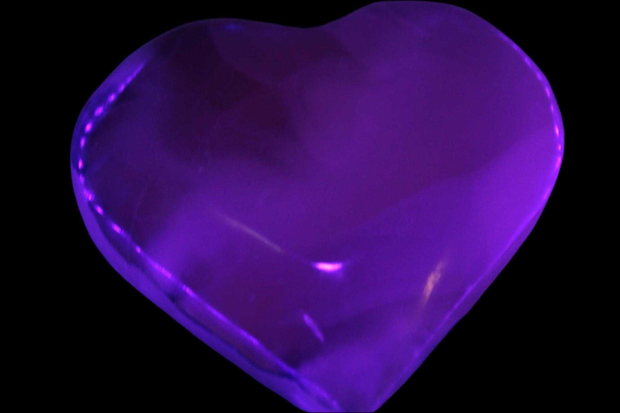 Mangano Calcite hand-carved heart 67-94mm  129-274g in UV light - Rocks and Things Store
