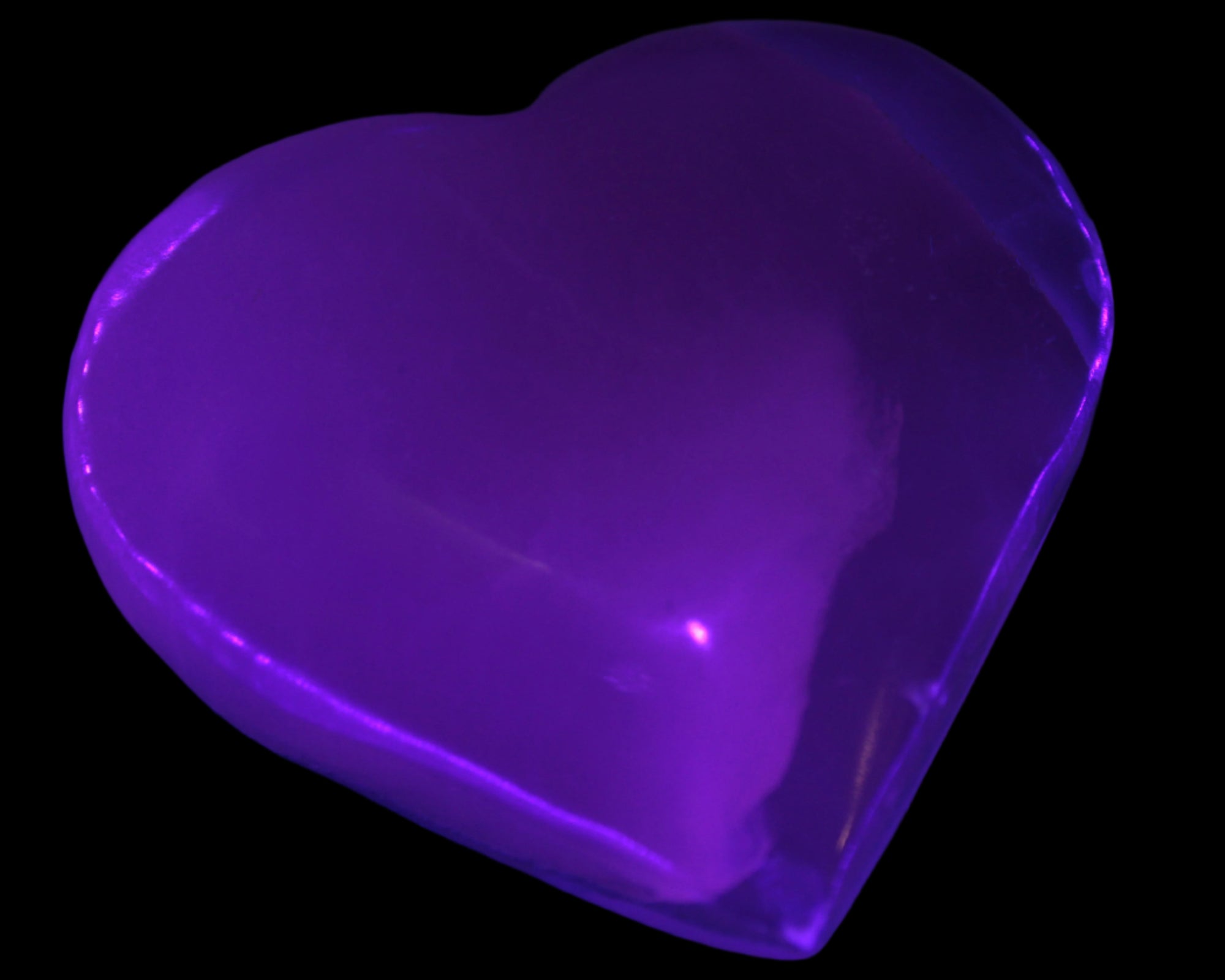 Mangano Calcite hand-carved heart 67-94mm  129-274g in UV light - Rocks and Things Store