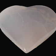 Mangano Calcite hand-carved heart 67-94mm  129-274g in sunlight - Rocks and Things Store
