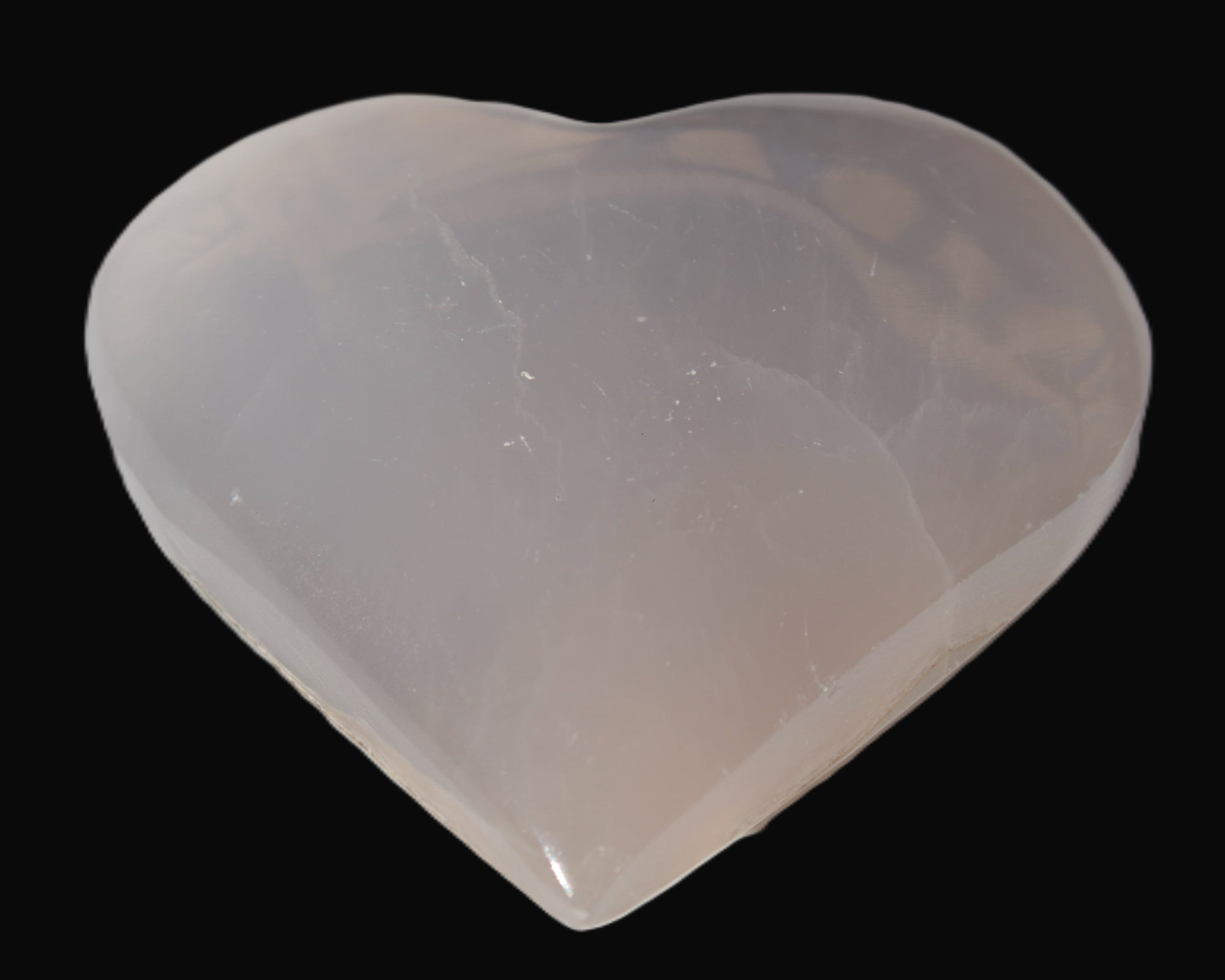 Mangano Calcite hand-carved heart 67-94mm  129-274g in sunlight - Rocks and Things Store
