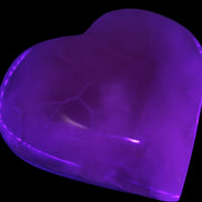 Mangano Calcite hand-carved heart 67-94mm  129-274g in UV light - Rocks and Things Store