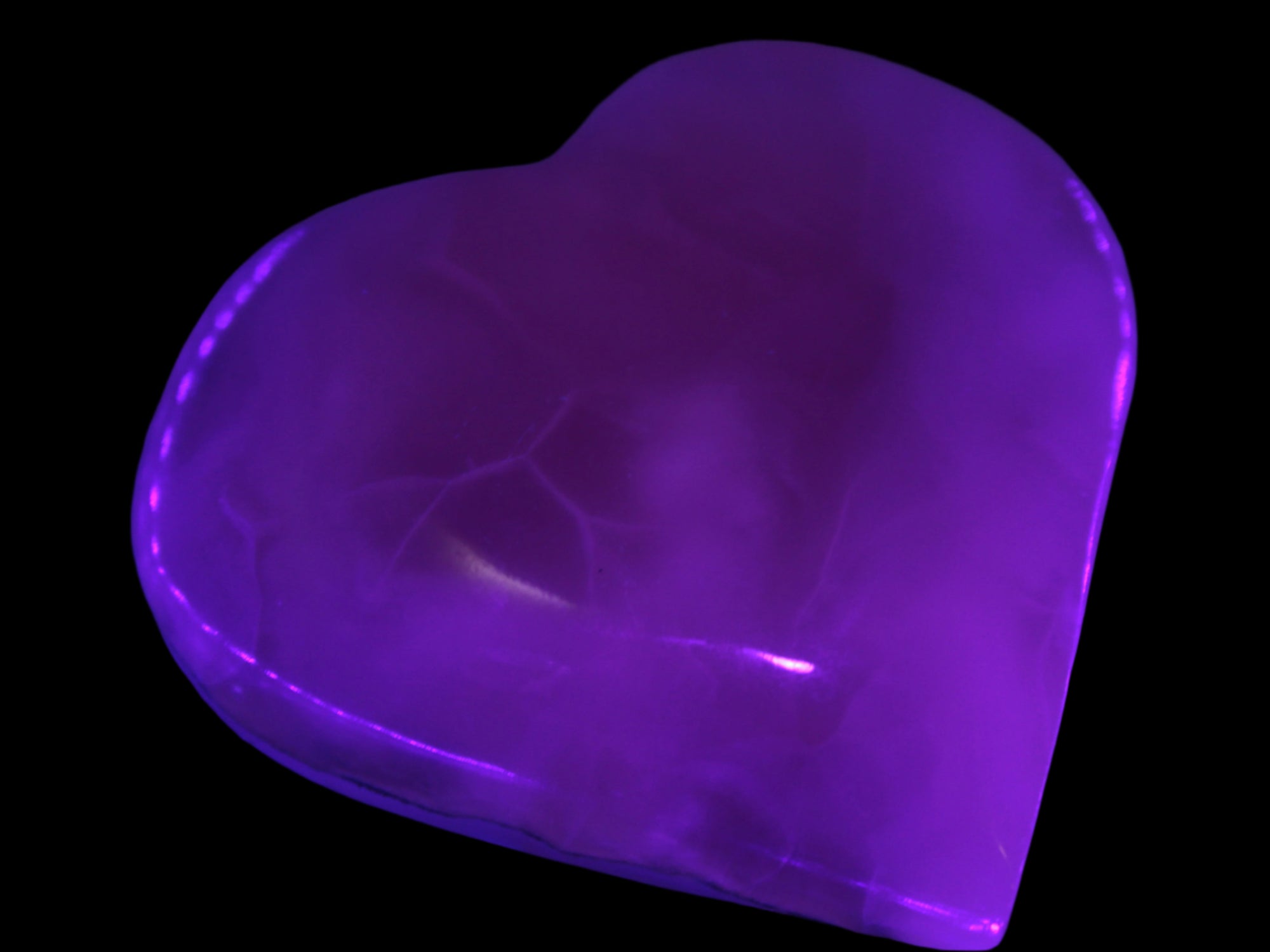 Mangano Calcite hand-carved heart 67-94mm  129-274g in UV light - Rocks and Things Store