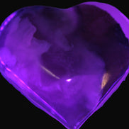 Mangano Calcite hand-carved heart 67-94mm  129-274g in UV light - Rocks and Things Store