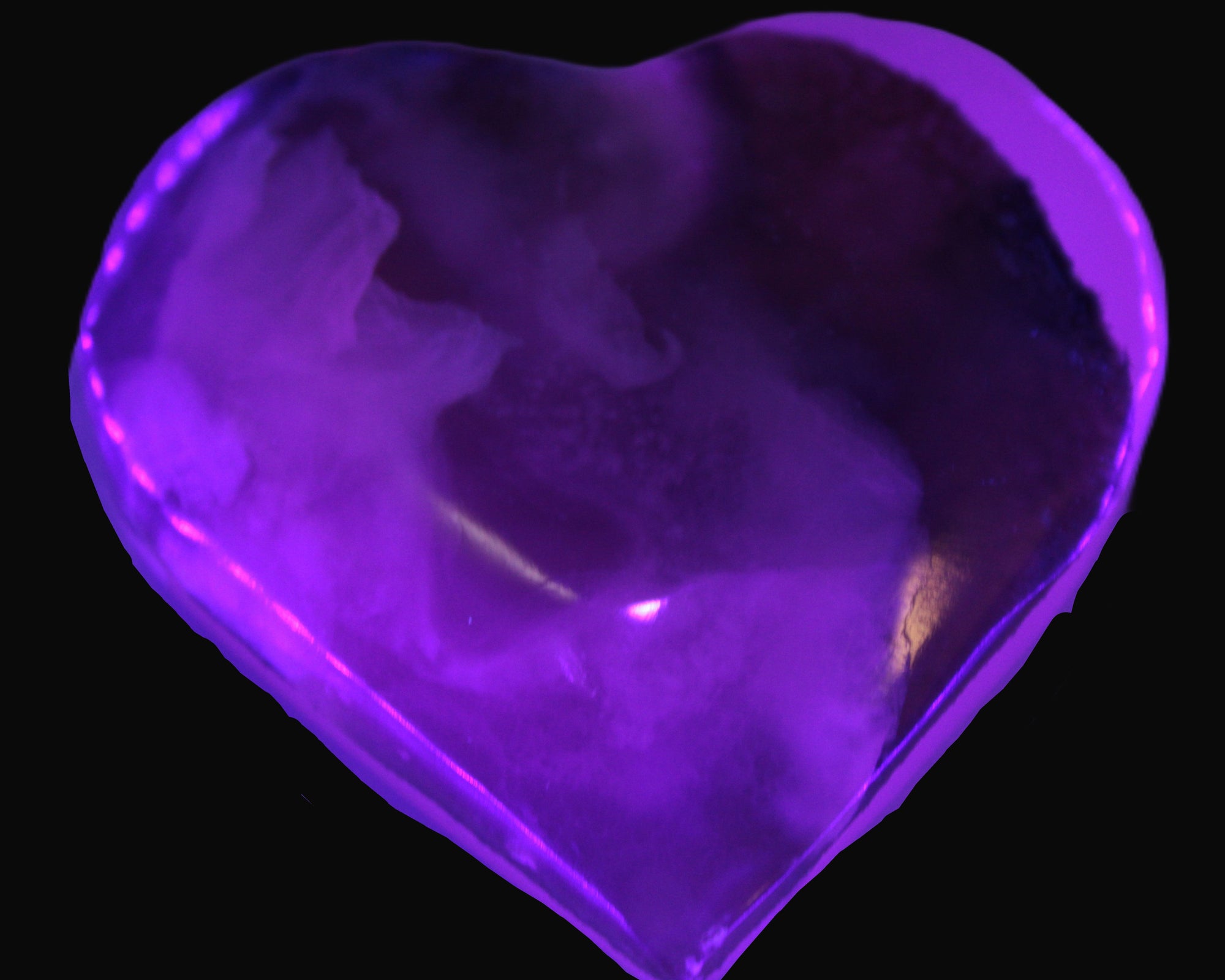 Mangano Calcite hand-carved heart 67-94mm  129-274g in UV light - Rocks and Things Store