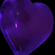 Mangano Calcite hand-carved heart 67-94mm  129-274g in UV light - Rocks and Things Store