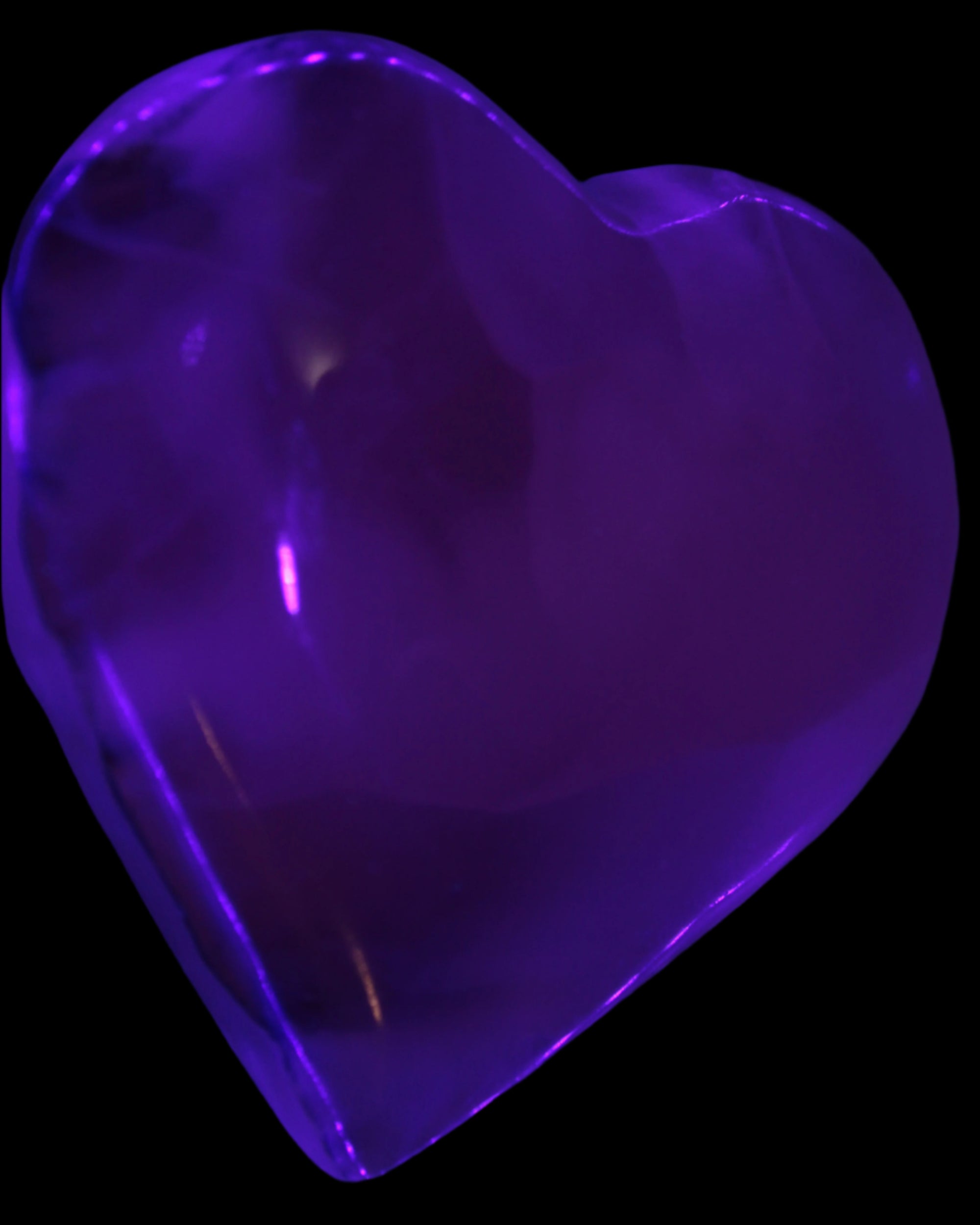 Mangano Calcite hand-carved heart 67-94mm  129-274g in UV light - Rocks and Things Store