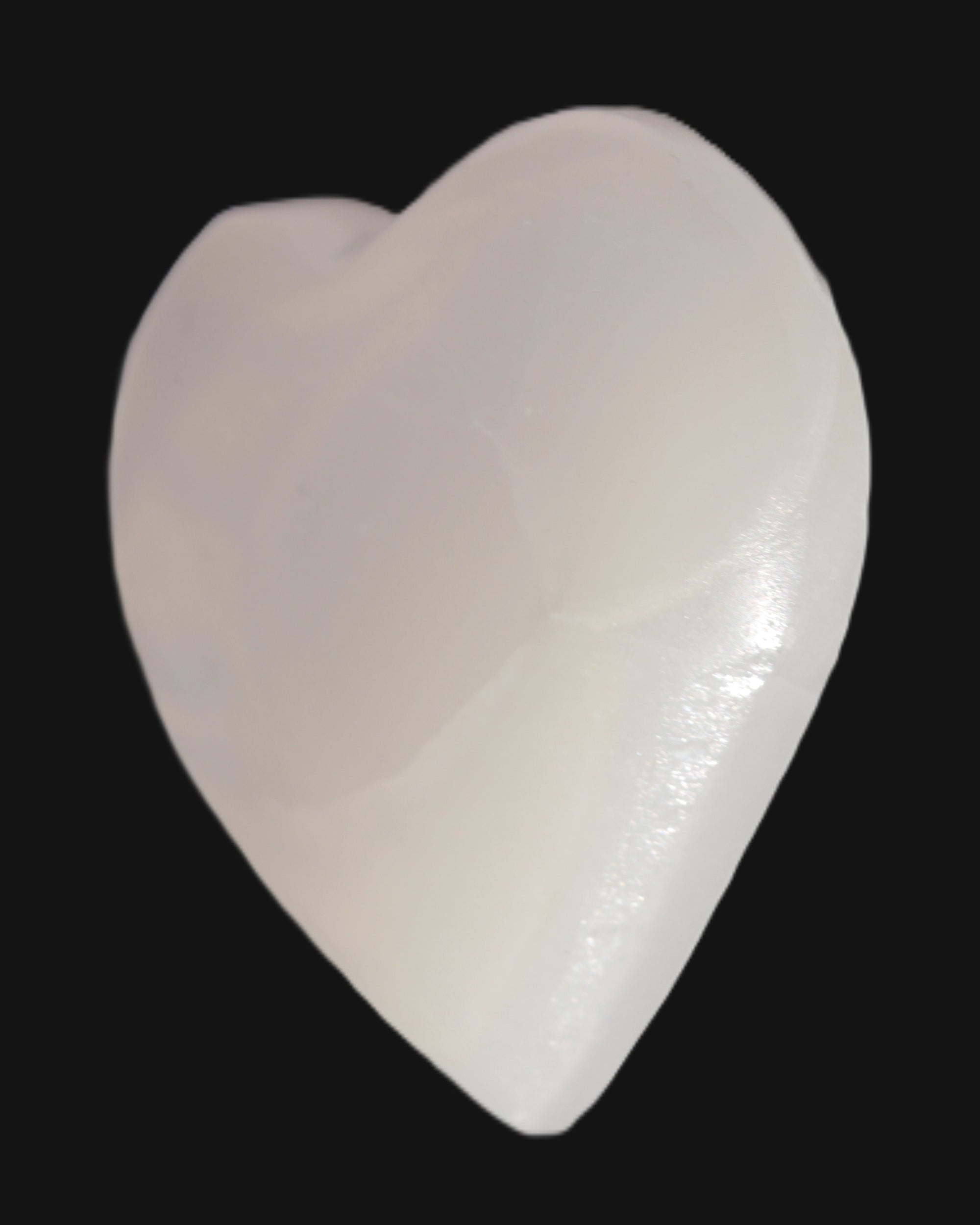 Mangano Calcite hand-carved heart 67-94mm  129-274g in sunlight - Rocks and Things Store
