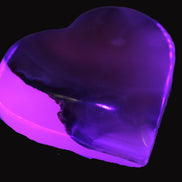 Mangano Calcite hand-carved heart 67-94mm  129-274g in UV light - Rocks and Things Store