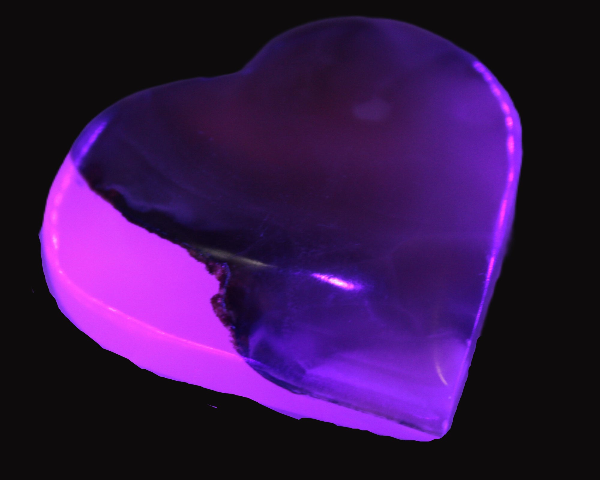 Mangano Calcite hand-carved heart 67-94mm  129-274g in UV light - Rocks and Things Store