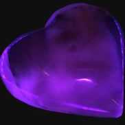 Mangano Calcite hand-carved heart 67-94mm  129-274g in UV light - Rocks and Things Store