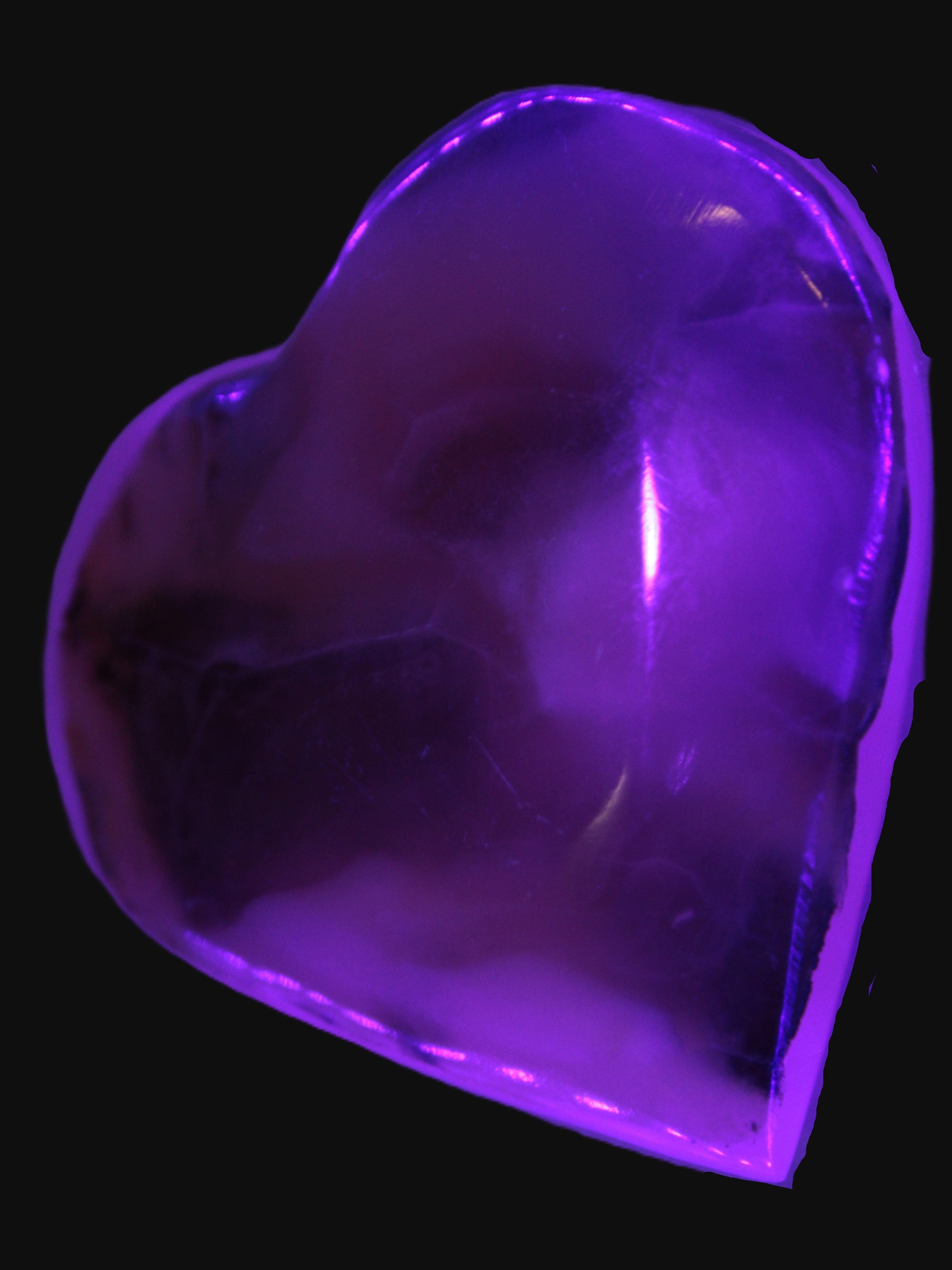 Mangano Calcite hand-carved heart 67-94mm  129-274g in UV light - Rocks and Things Store
