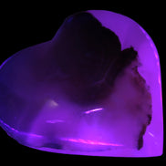Mangano Calcite hand-carved heart 67-94mm  129-274g in UV light - Rocks and Things Store