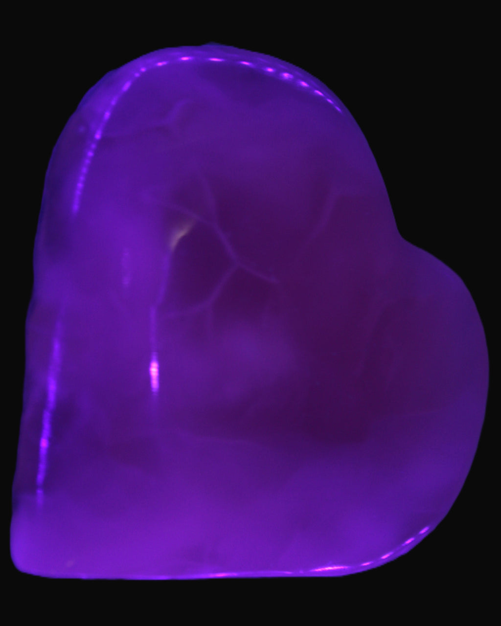 Mangano Calcite hand-carved heart 67-94mm  129-274g in UV light - Rocks and Things Store