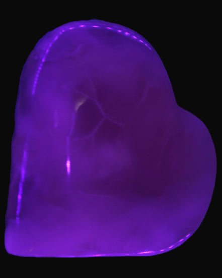 Mangano Calcite hand-carved heart 67-94mm  129-274g in UV light - Rocks and Things Store