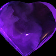 Mangano Calcite hand-carved heart 67-94mm  129-274g in UV light - Rocks and Things Store