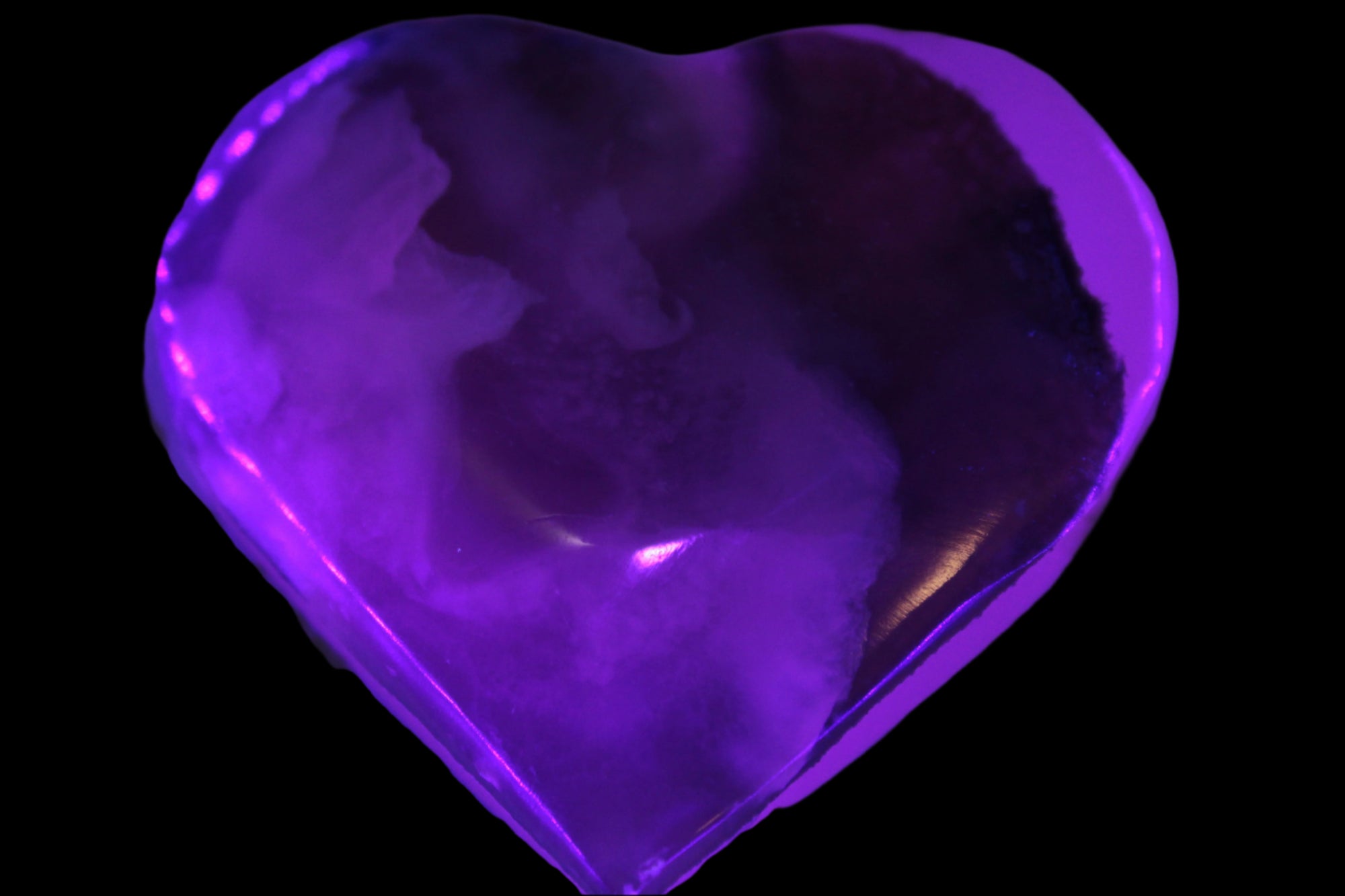Mangano Calcite hand-carved heart 67-94mm  129-274g in UV light - Rocks and Things Store