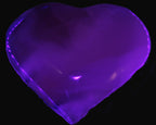 Mangano Calcite hand-carved heart 67-94mm  129-274g in UV light - Rocks and Things Store