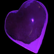 Mangano Calcite hand-carved heart 60-65mm  112-117g in UV light - Rocks and Things Store