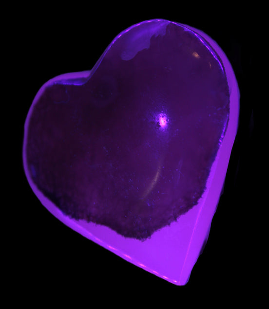 Mangano Calcite hand-carved heart 60-65mm  112-117g in UV light - Rocks and Things Store