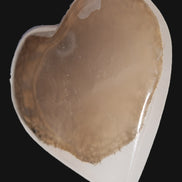 Mangano Calcite hand-carved heart 60-65mm  112-117g in sun light - Rocks and Things Store
