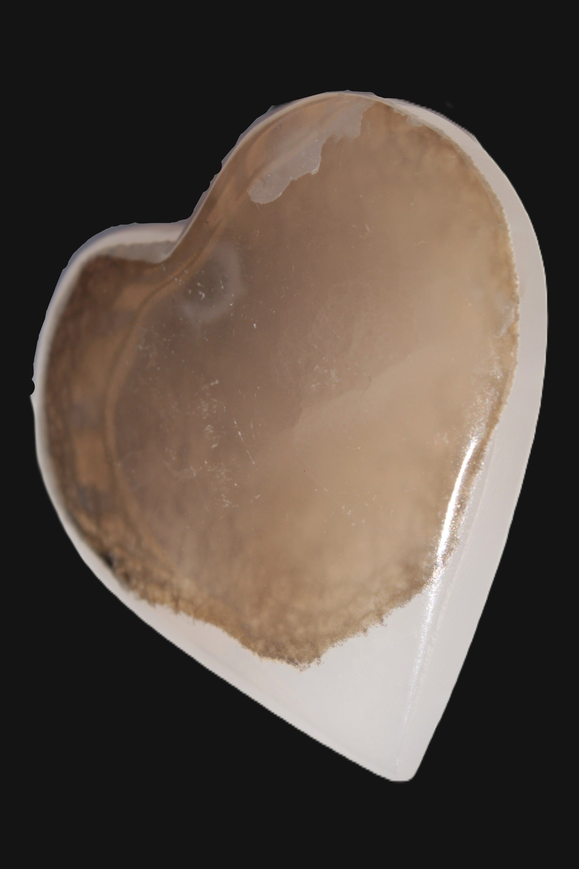 Mangano Calcite hand-carved heart 60-65mm  112-117g in sun light - Rocks and Things Store