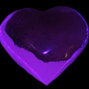 Mangano Calcite hand-carved heart 60-65mm  112-117g in sun light - Rocks and Things Store