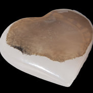 Mangano Calcite hand-carved heart 60-65mm  112-117g in sun light - Rocks and Things Store