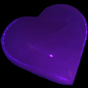 Mangano Calcite hand-carved heart 60-65mm  112-117g in UV light -  Rocks and Things Store