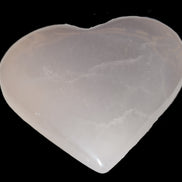 Mangano Calcite hand-carved heart 60-65mm  112-117g in sunlight -  Rocks and Things Store