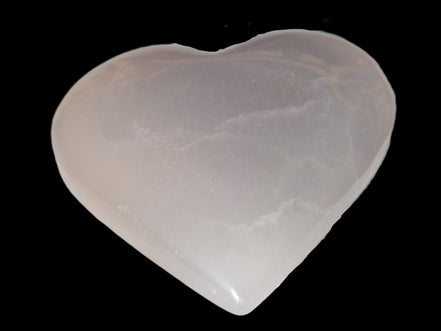 Mangano Calcite hand-carved heart 60-65mm  112-117g in sunlight -  Rocks and Things Store