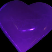 Mangano Calcite hand-carved heart 60-65mm  112-117g in UV light -  Rocks and Things Store
