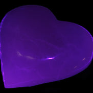 Mangano Calcite hand-carved heart 60-65mm  112-117g in UV light -  Rocks and Things Store