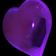 Mangano Calcite hand-carved heart 60-65mm  112-117g in UV light -  Rocks and Things Store