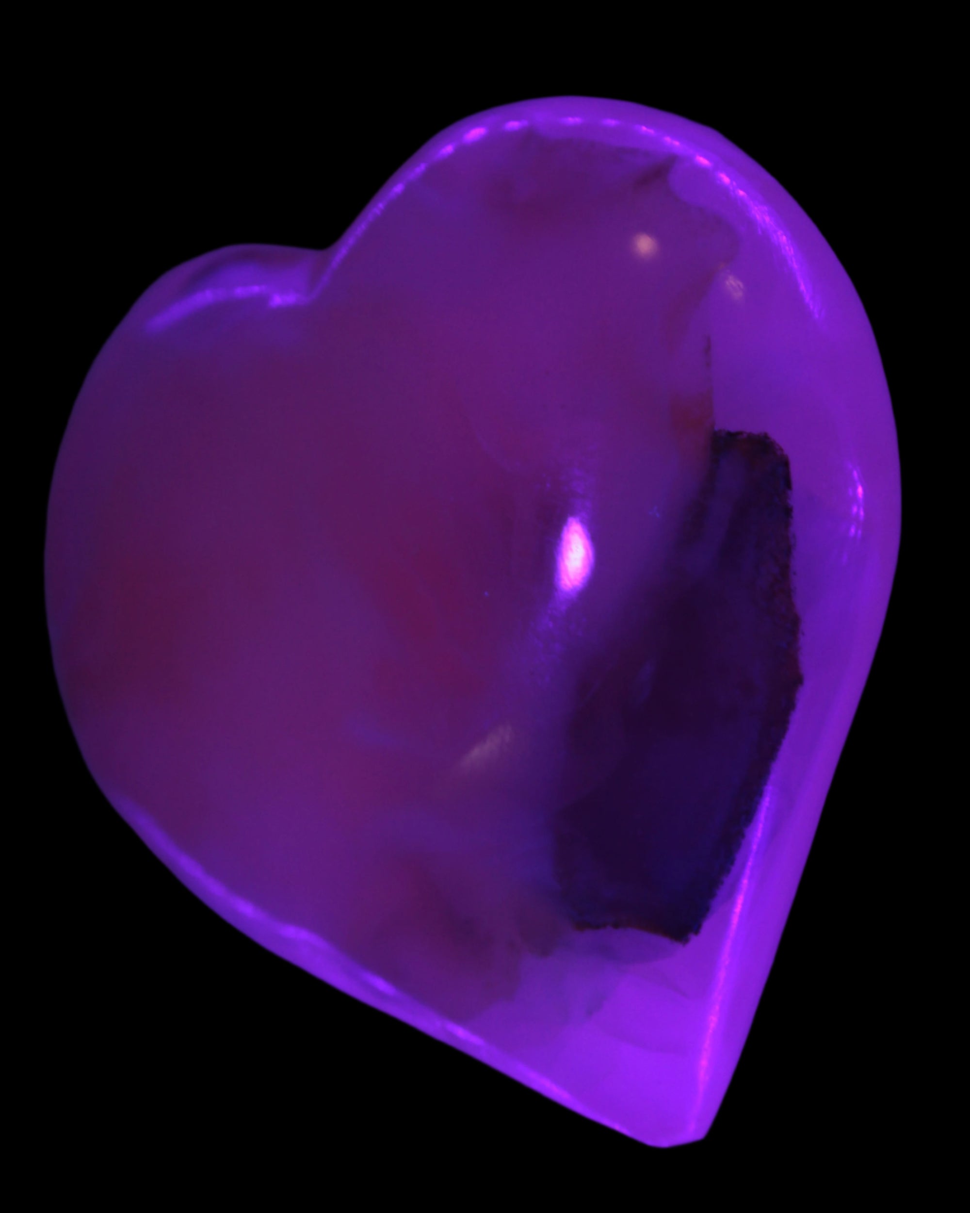 Mangano Calcite hand-carved heart 60-65mm  112-117g in UV light -  Rocks and Things Store