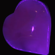 Mangano Calcite hand-carved heart 60-65mm  112-117g in UV light -  Rocks and Things Store