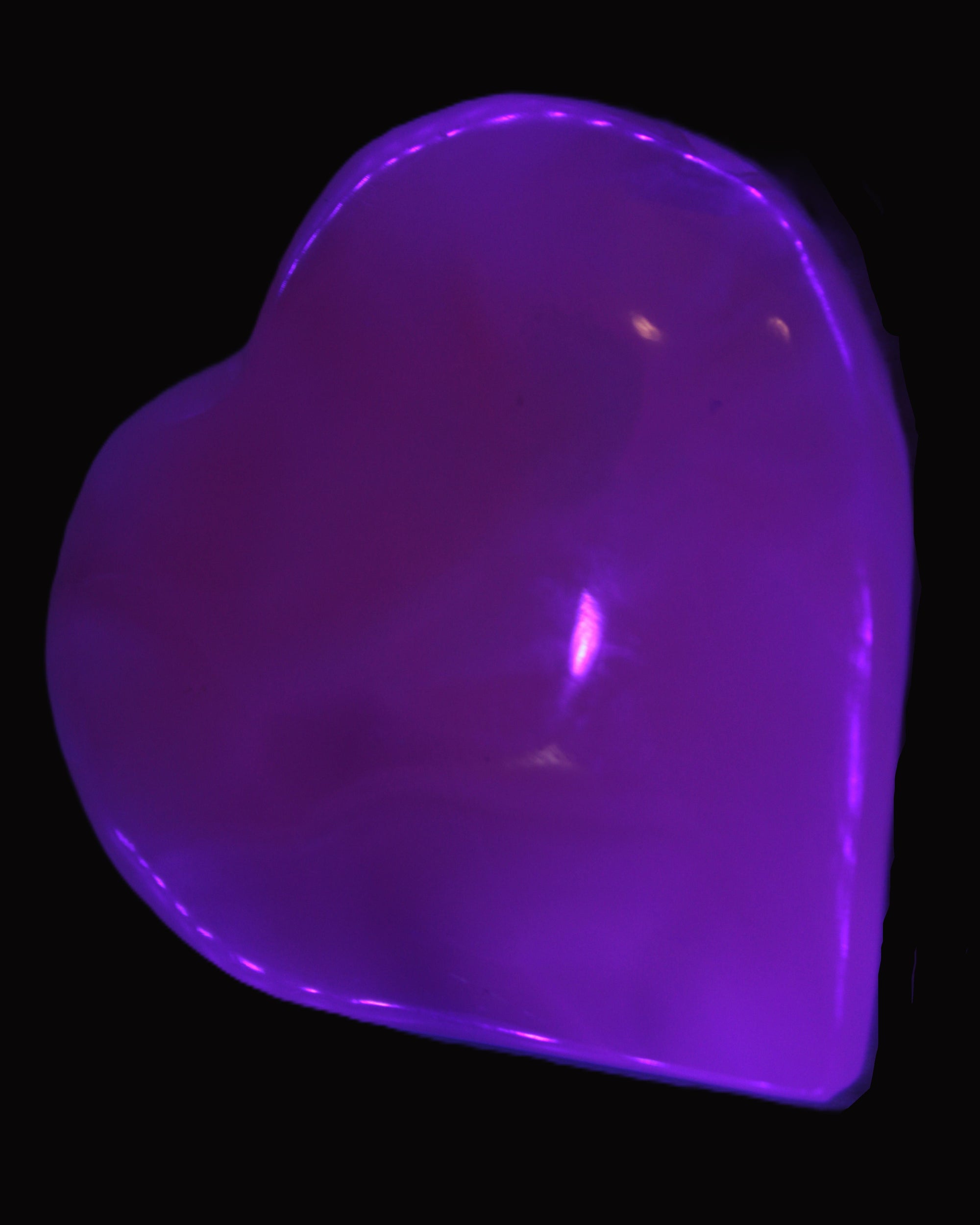 Mangano Calcite hand-carved heart 60-65mm  112-117g in UV light -  Rocks and Things Store