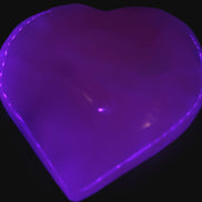 Mangano Calcite hand-carved heart 60-65mm  112-117g in UV light -  Rocks and Things Store