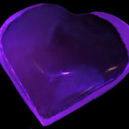 Mangano Calcite hand-carved heart 60-65mm  112-117g in UV light -  Rocks and Things Store