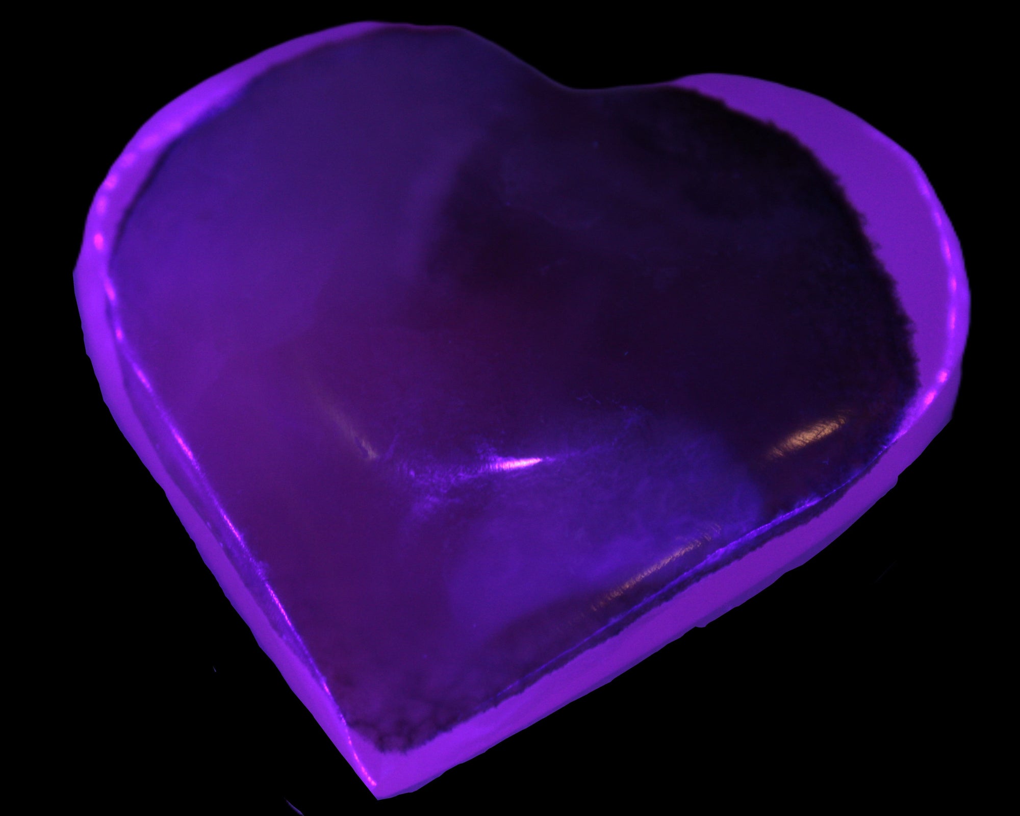 Mangano Calcite hand-carved heart 60-65mm  112-117g in UV light -  Rocks and Things Store