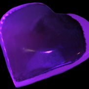 Mangano Calcite hand-carved heart 60-65mm  112-117g in UV light -  Rocks and Things Store