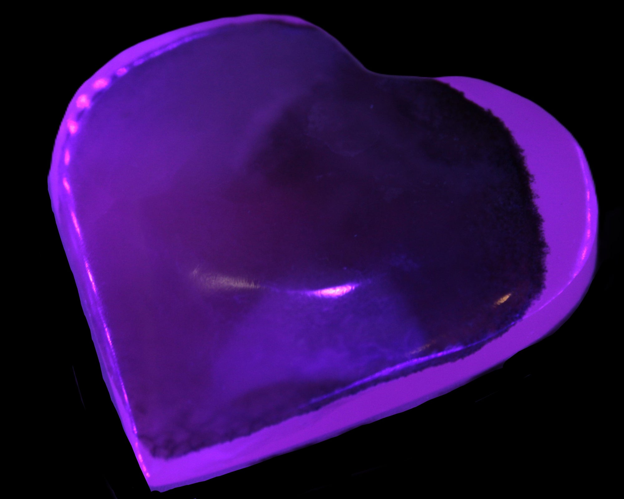 Mangano Calcite hand-carved heart 60-65mm  112-117g in UV light -  Rocks and Things Store
