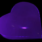 Mangano Calcite hand-carved heart 60-65mm  112-117g in UV light -  Rocks and Things Store