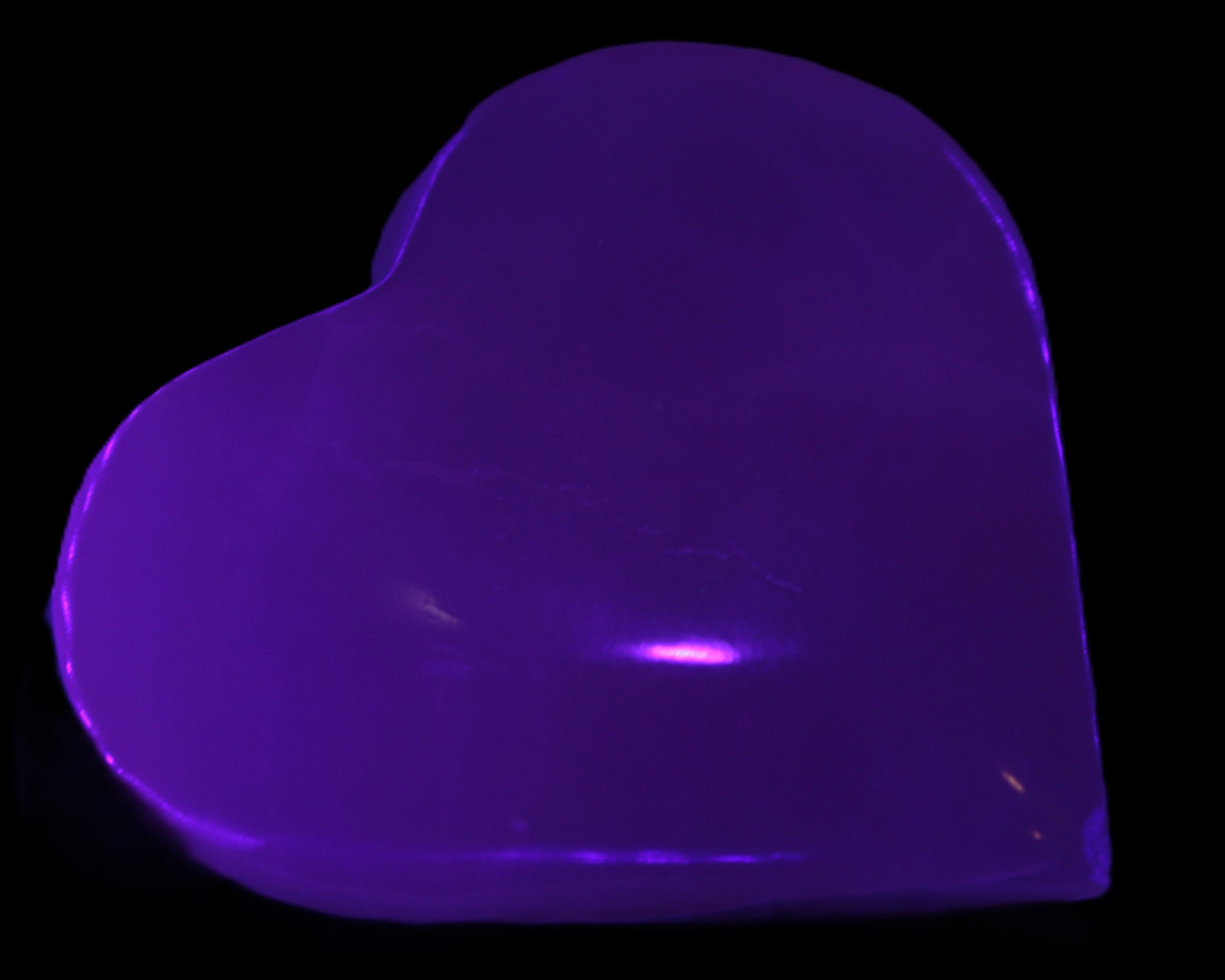 Mangano Calcite hand-carved heart 60-65mm  112-117g in UV light -  Rocks and Things Store