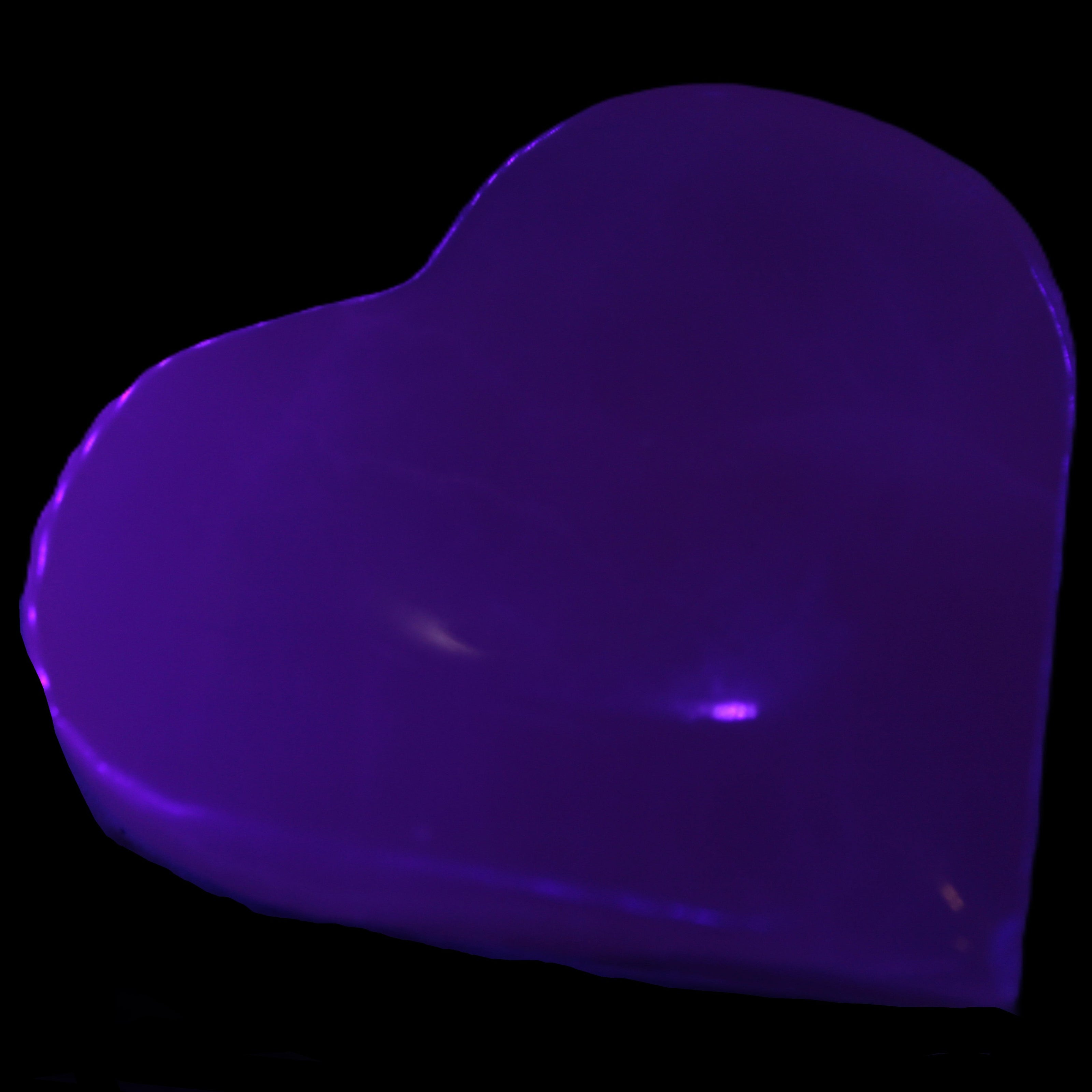 Mangano Calcite hand-carved heart 60-65mm  112-117g in UV light -  Rocks and Things Store  112-117g Rocks and Things