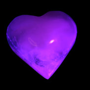Mangano Calcite hand-carved heart 47-49mm 58-66g in UV light - Rocks and Things Store