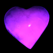 Mangano Calcite hand-carved heart 47-49mm 58-66g in UV light - Rocks and Things Store