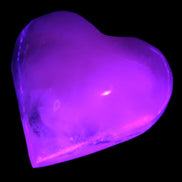Mangano Calcite hand-carved heart 47-49mm 58-66g in UV light - Rocks and Things Store